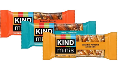 Four KIND minis protein bars arranged in a fan shape on a white background, showing Peanut Butter, Dark Chocolate, and Caramel Almond & Sea Salt flavors.